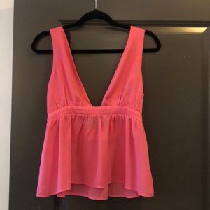 Pink sleeveless shirt.